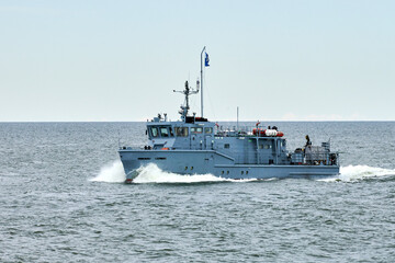 Russian warship armed with armament sails into sea toward military target to attack and destroy...