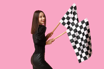 Beautiful young woman with racing flags on pink background © Pixel-Shot