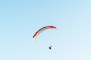 Paragliders in the sky. Man paragliding in a blue sky, on Cerro el Morro from Lechería, Venezuela
