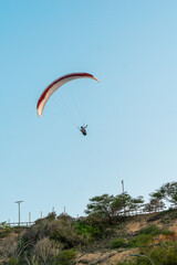 Paragliders in the sky. Man paragliding in a blue sky, on Cerro el Morro from Lechería, Venezuela