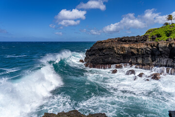 Waves hitting the Lava rock, Makahuena Light, Koloa, Kauai South Shore, Hawaii. Koloa Volcanics,...