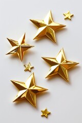 Obraz premium A collection of golden stars arranged on a plain white background