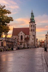 Obraz premium Krakow old town, romanesque St Andrew church on Grodzka street during colorful sunrise