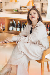 A young beautiful woman in a suit is a restaurant owner or manager. Influencer and smm manager
