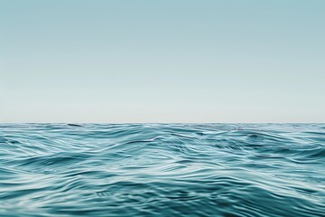 Obraz premium A minimalist representation of the ocean with waves and a clear sky
