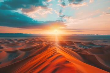 Aerial view of sunset over desert sand dunes