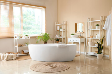 Interior of modern stylish bathroom with hanging bathrobe