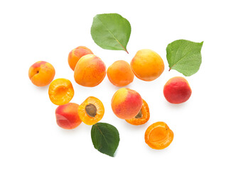 Flying apricots with leaves isolated on white background