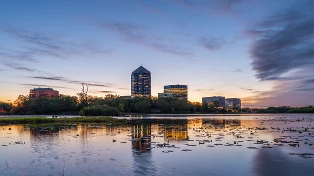 Bloomington, Illinois, USA skyline on Lake Normandale at dawn.
