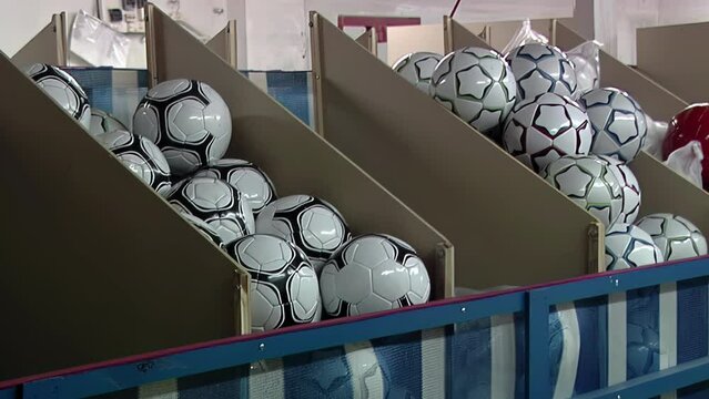 Soccer Ball Being Tossed into Storage Box at Factory - 4K  