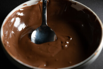 a bowl of pudding and a spoon