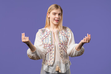 Young teenager girl with money gesture on violet studio. Rich smart lady smiling
