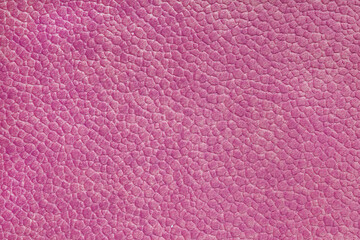 Velours pink fabric with with embossed pattern like leather structure texture close up, macro. Upholstery decorative cloth structure, canvas for home decor. Background, backdrop, wallpaper.