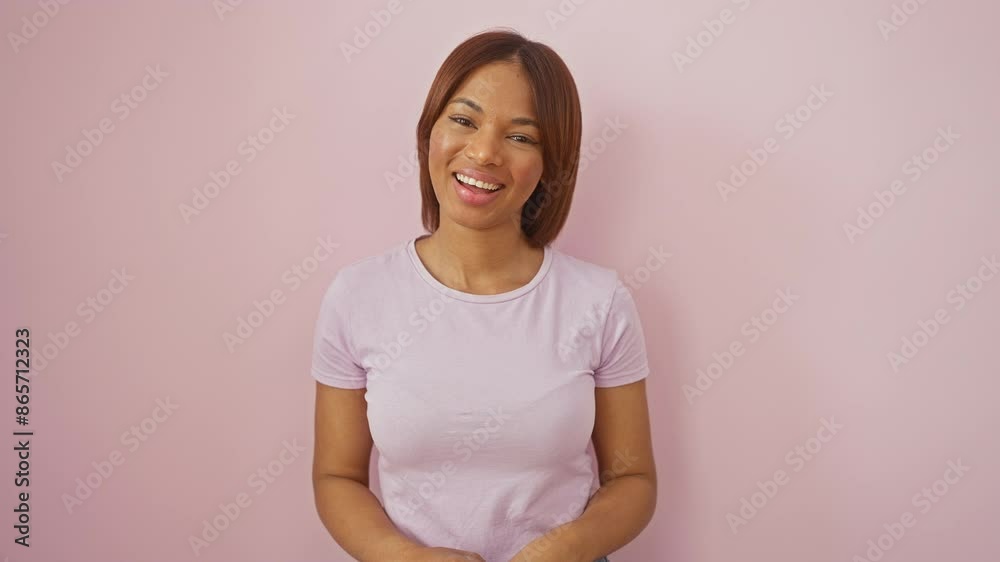 Sticker Joyful african american woman, gleaming with confidence, standing tall and smiling brilliantly, radiating positivity against an isolated pink background