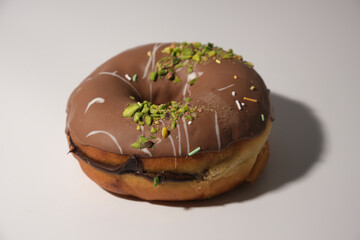 large chocolate donut on white background
