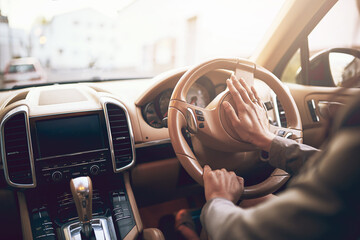 Obraz premium Hands, car and person on steering wheel with drive for roadtrip, travel and adventure. Driver, road and vehicle or transport with commuting for journey, getaway and holiday with pressing horn