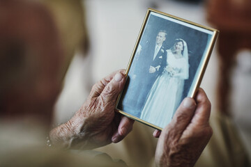Hands, remember and senior person with photograph for past life history, retirement and nostalgia...