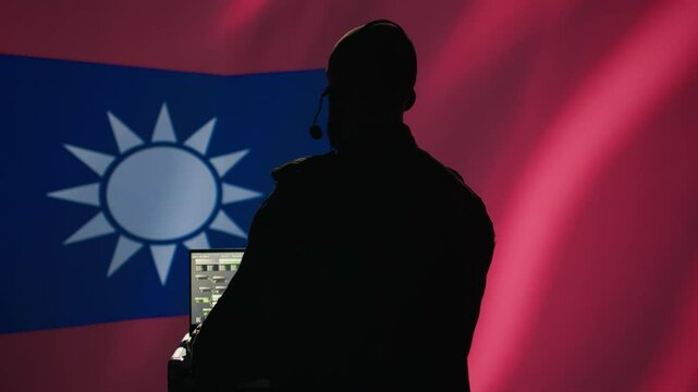 Taiwanese insurgent uses laptop to combat Chinese mass propaganda promoting One China policy, engaging in psychological operations. Taiwan spy defends against CCP PsyOp sabotage using device, camera B