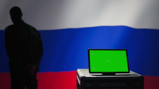 ex KGB FSB secret police agent using mass propaganda tools on green screen laptop to influence population minds. Russian spy silencing online opposition voices using mockup notebook, camera B