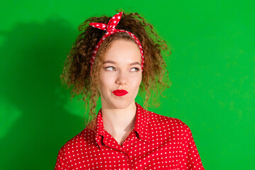 Photo portrait of lovely young lady look skeptical empty space dressed stylish red retro garment...