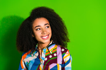 Portrait of pretty young woman look empty space wear shirt isolated on green color background