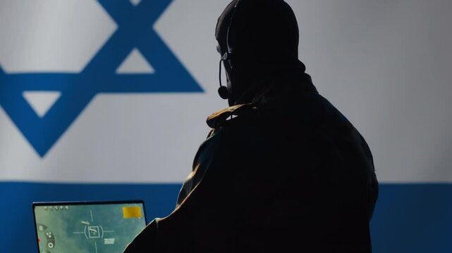 Israeli air defense operator using radar detecting missile attacks and conducting space surveillance and satellite tracking. Israel Mossad agent using military software preventing rockets, camera A