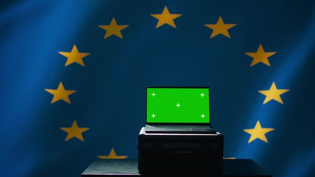 EU alliance engineer uses green screen laptop to protect against fake accounts on social media. Technician doing cybersecurity job for European Union with mockup notebook, camera B