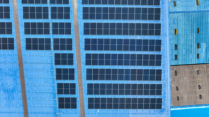 top view of grid of technology renewable solar energy. construction solar panels system on roof. Installing solar photovoltaic panel system. background of blue of solar cell system and structure roof.