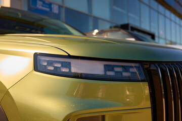 Obraz premium Close up of a cars headlight, part of automotive design