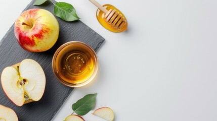 View of writing slate with apple slice honey in bowl on white background Empty space education learning sweet fruit healthy autumn concept