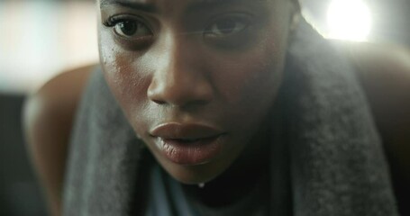 Breathing, face and fitness with tired woman in gym for exercise, training or workout routine. Challenge, intense and sweat with exhausted African person in health club for fatigue or performance