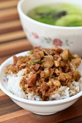 Taiwanese braised pork rice features savory minced pork over fluffy rice, creating a mouthwatering dish renowned for its unique texture and flavor, enhanced with suitable soups and side dishes.
