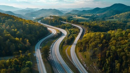 Scenic Aerial View of Winding Mountain Highway through Autumn Foliage Landscape