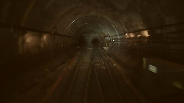 Underground subway tunnel. The train moves through the tunnel. Public transport.