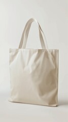 A simple beige tote bag with a minimalist design and two handles, positioned on a light background.