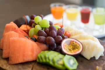 a closeup shot of various fruits and vegetables on a wooden table