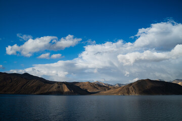 The blue waters of Pangong Lake are surrounded by the Himalayas. It is a large lake in Ladakh where China and India coexist according to India China.