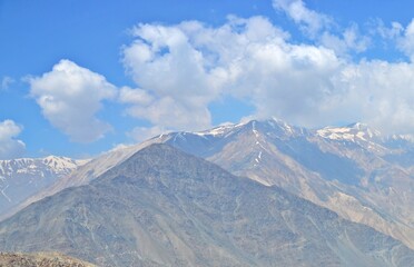 A panoramic view of majestic mountains stretching across the horizon.