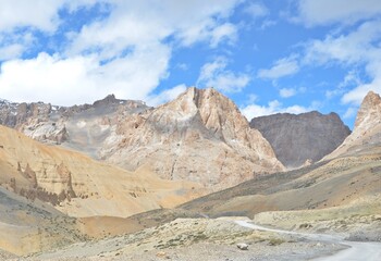 Leh Mountain Peaks Shrouded in Clouds under Clear Blue Sky