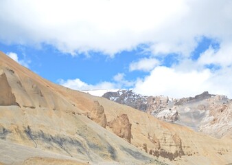 Leh Mountain Peaks Shrouded in Clouds under Clear Blue Sky