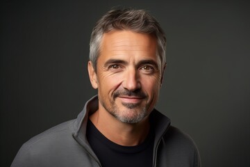 Fototapeta premium Handsome middle-aged man in a gray sweatshirt.