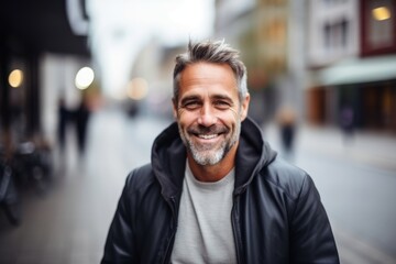 Obraz premium Portrait of a handsome middle-aged man in a city street