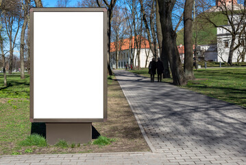 Blank Wooden Billboard Mockup In City Park. Outdoor Advertising Poster Lightbox On The Sidewalk