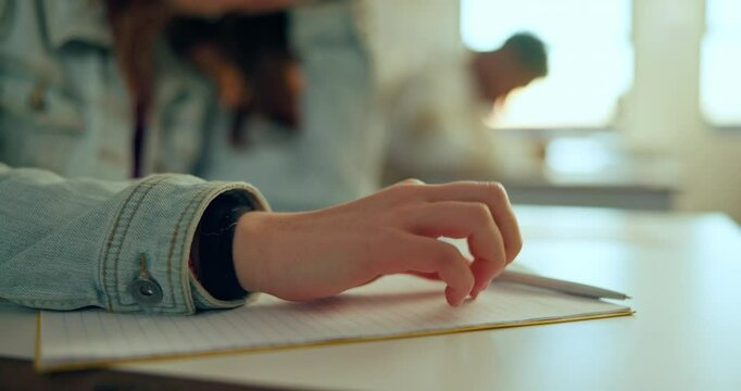 Education, anxiety and student hands in classroom nervous for test, grade and examination. School, learning and girl tapping fingers on a desk with stress, adhd and pressure, fear or overthinking