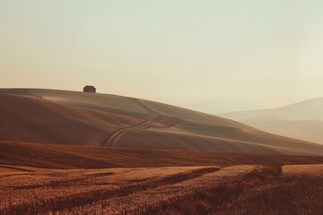 Fototapeta premium Rolling hills with distant farmhouse