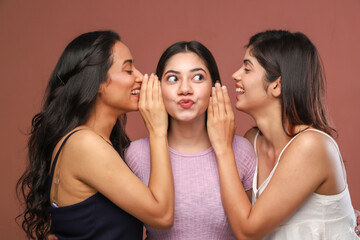 3 Hot Women Standing, In Which Two Women Whispering A Secret In Third Girl Ears