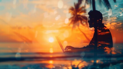 Fototapeta premium Silhouette of a person working on a laptop during a vibrant sunset at a tropical beach, blending work and leisure with stunning ocean views.