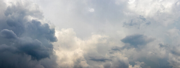 The rainy sky is covered with gray-blue clouds