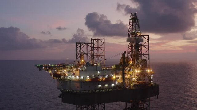 Aerial view of an offshore jack up drilling rig during sunset - oil and gas upstream industry
