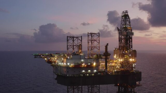 Aerial view of an offshore jack up drilling rig during sunset - oil and gas upstream industry
